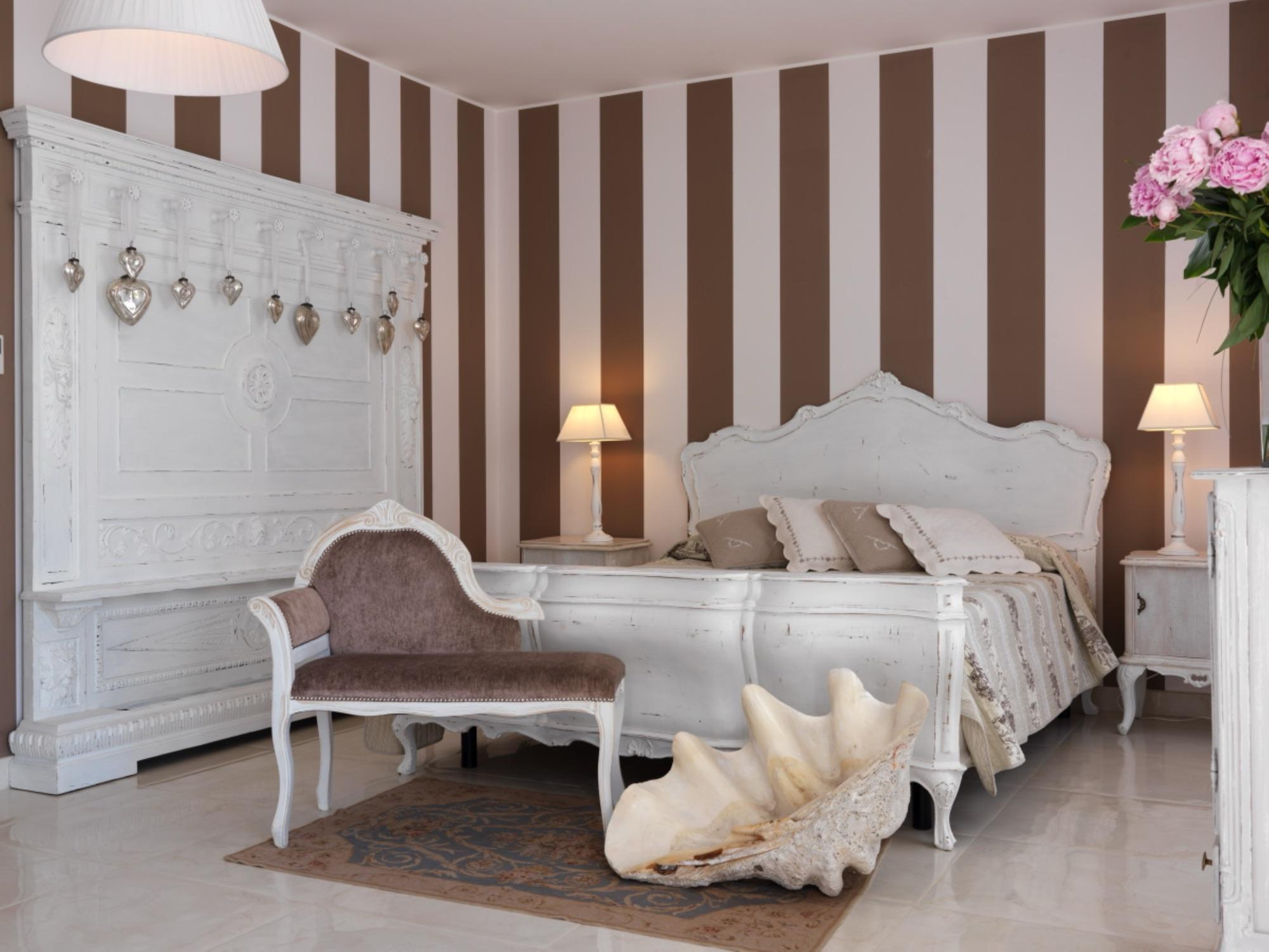 Family Junior Suite con pareti a righe e salottino